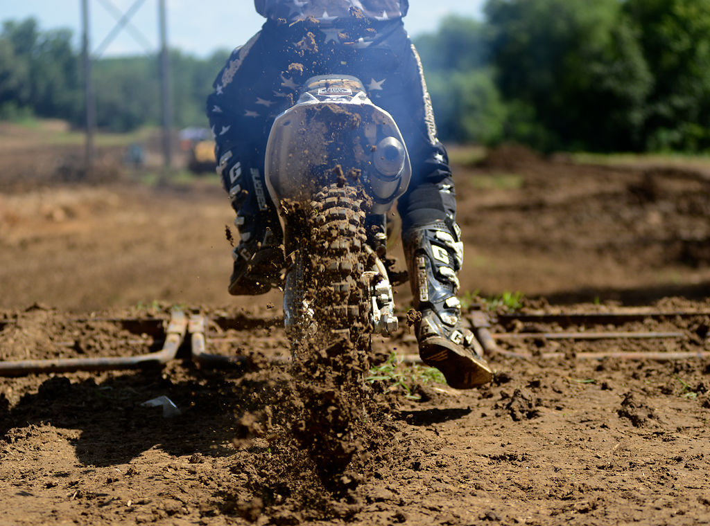 A rider speeds away from his starting position